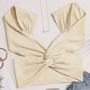 Cream colored knotted top with mostly opened back